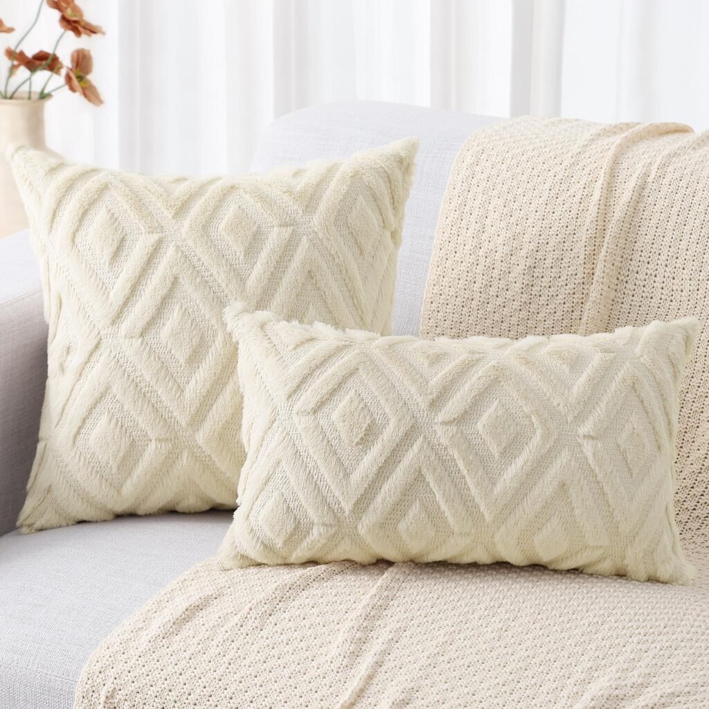 Luxury cream-colored plush cushions with a raised diamond geometric pattern on a sofa.
